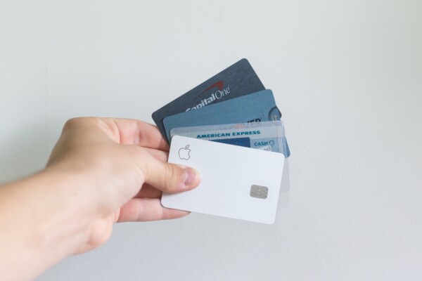 someone holding credit cards