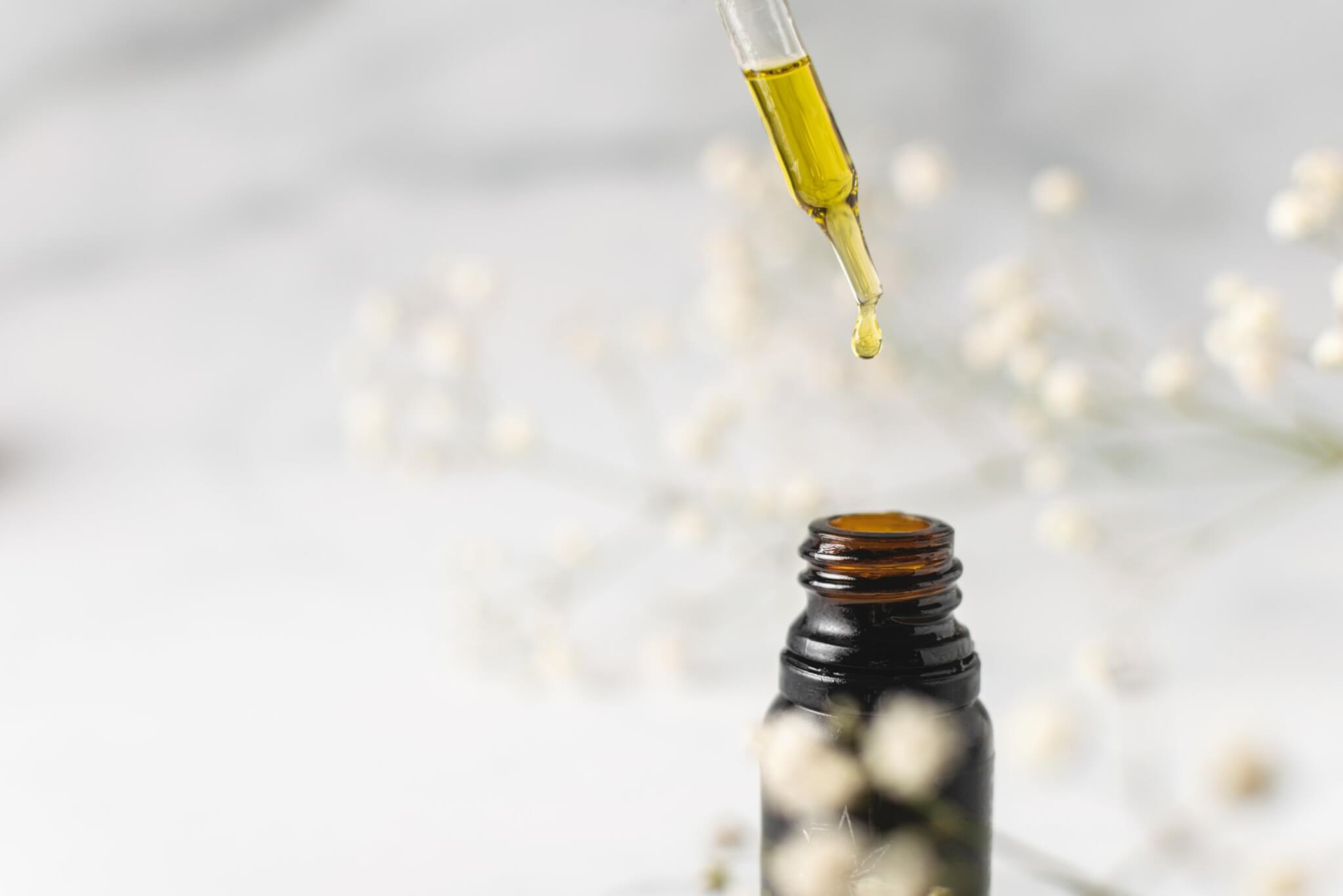Dropper with a bottle of essential oils