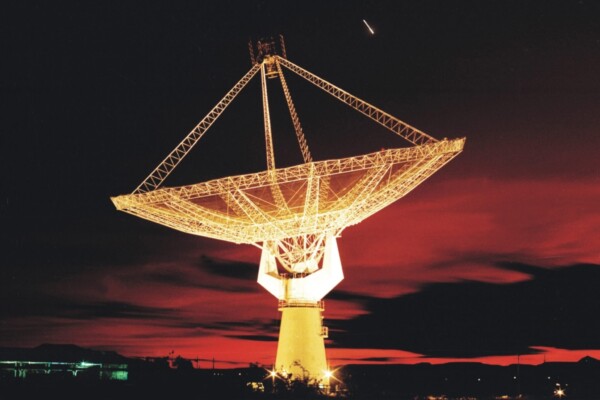 A radio telescope at night