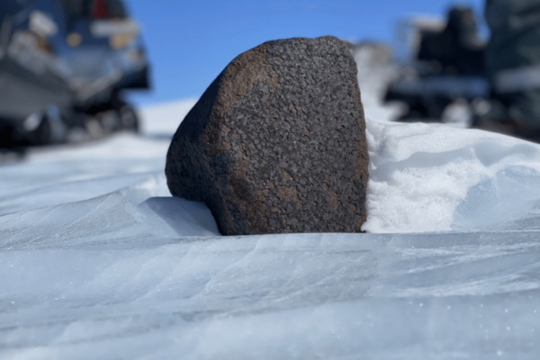 Meteorite sitting in the snow