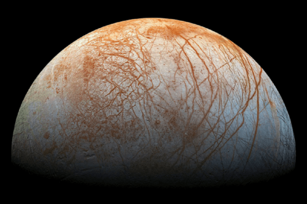 pic of Jupiter's moon, Europa, with red streaks across its surface.