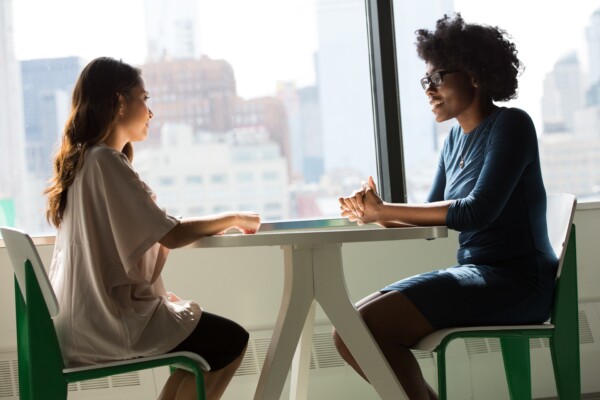 Friends or coworkers having a conversation