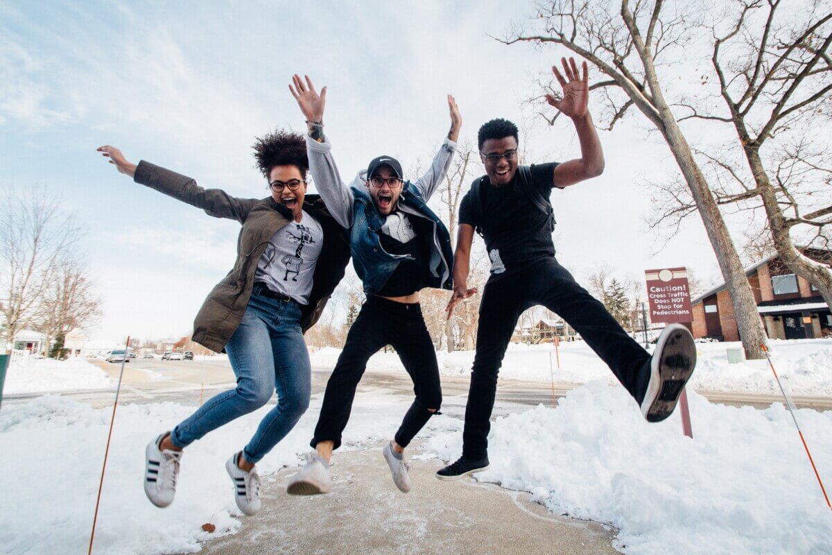 Happy teens jumping in the air