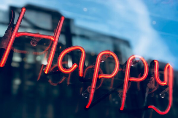 Neon lights that say "Happy"