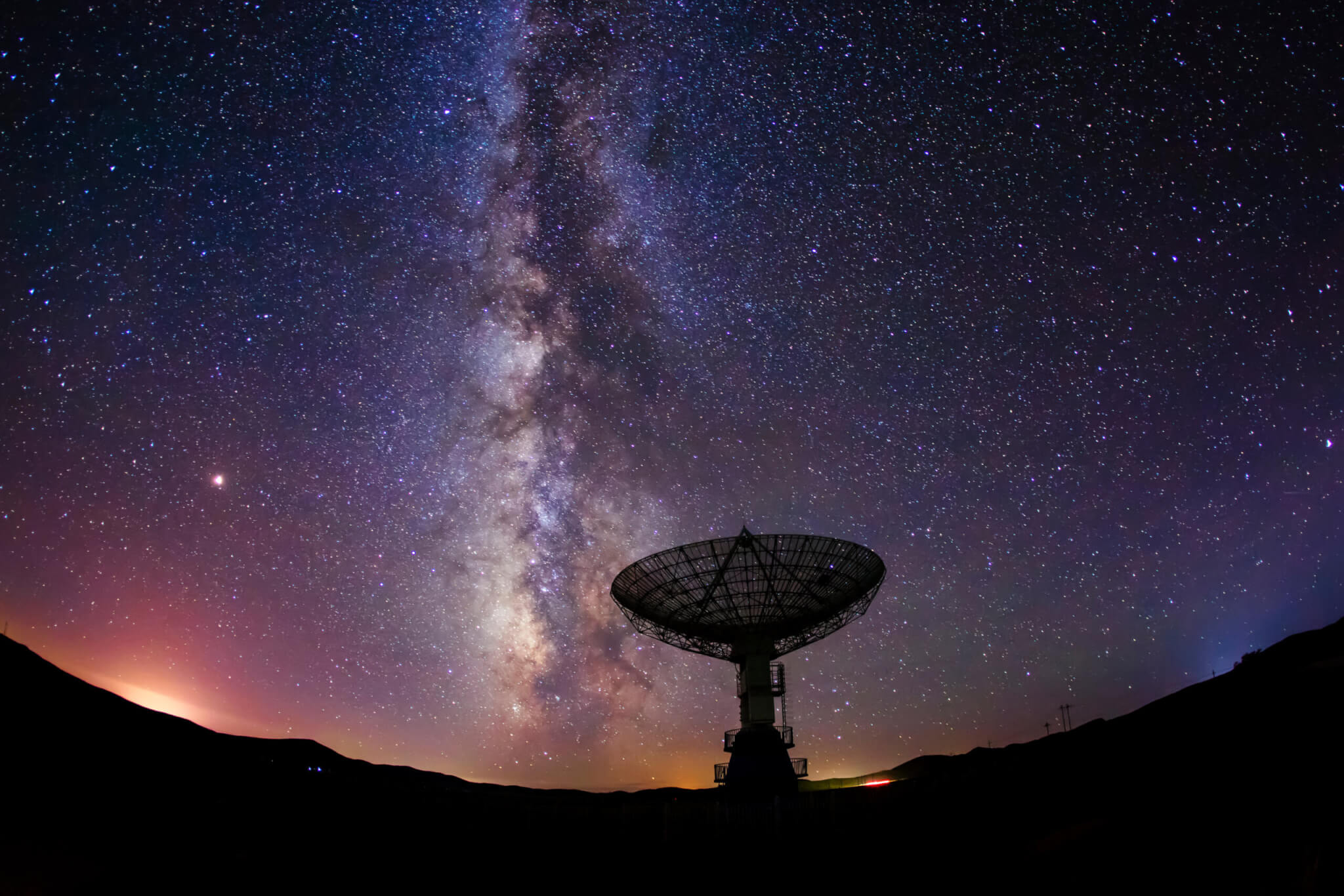 Illustration of a radio telescope satellite pointed at the stars in space.
