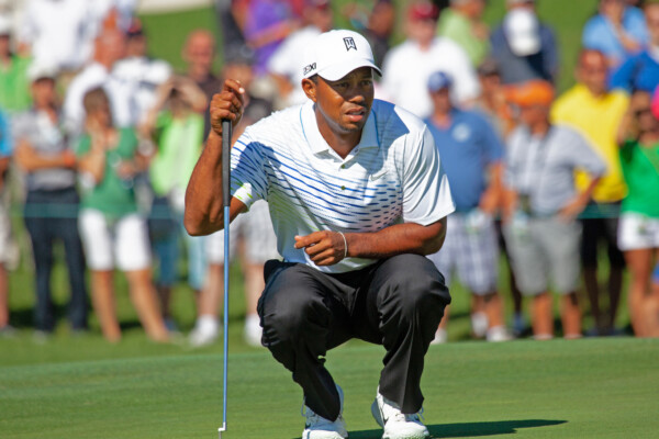 Tiger Woods measures a putt at Atunyote golf course, Turning Stone Resorts in August 2012.