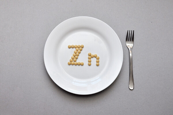 Zinc supplement tablets on a plate