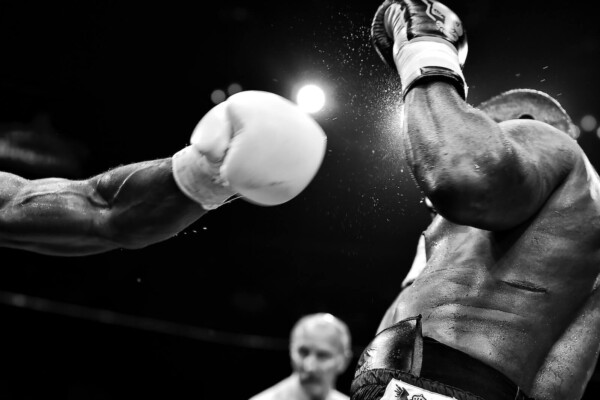 Black and white image of two boxers during a bout