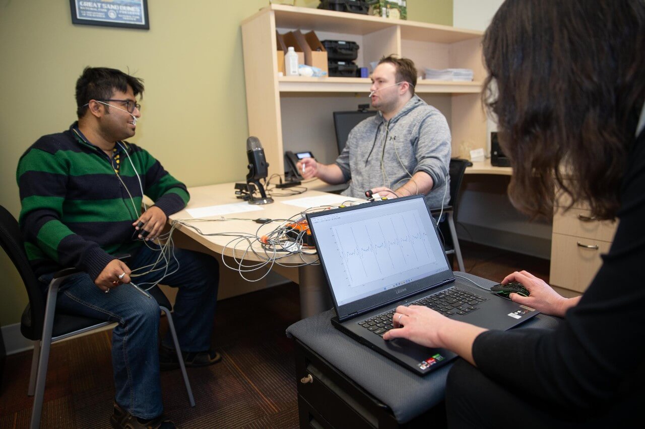 engineering students test a computer program measuring their bodies during conversation