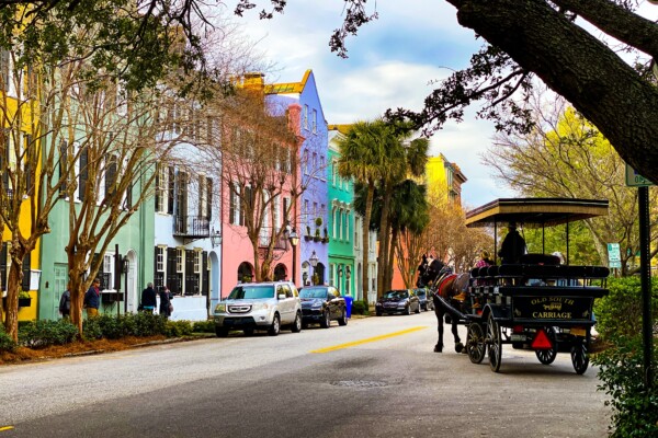 Rainbow Row in Charleston with a horse-drawn carriage
