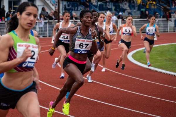 Women running race during track and field tournament