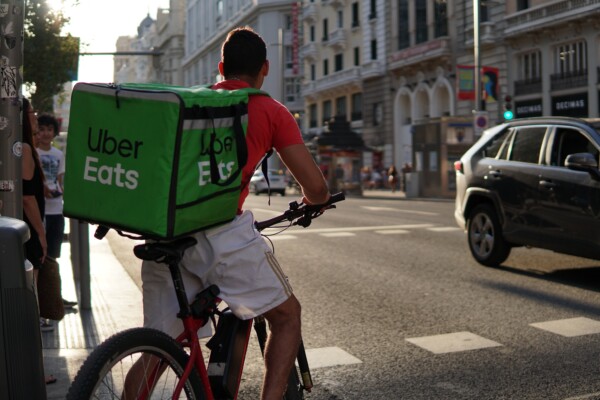 UberEats delivery person on the street, best delivery apps