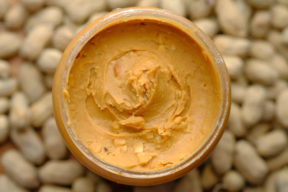 Peanut butter jar with peanuts