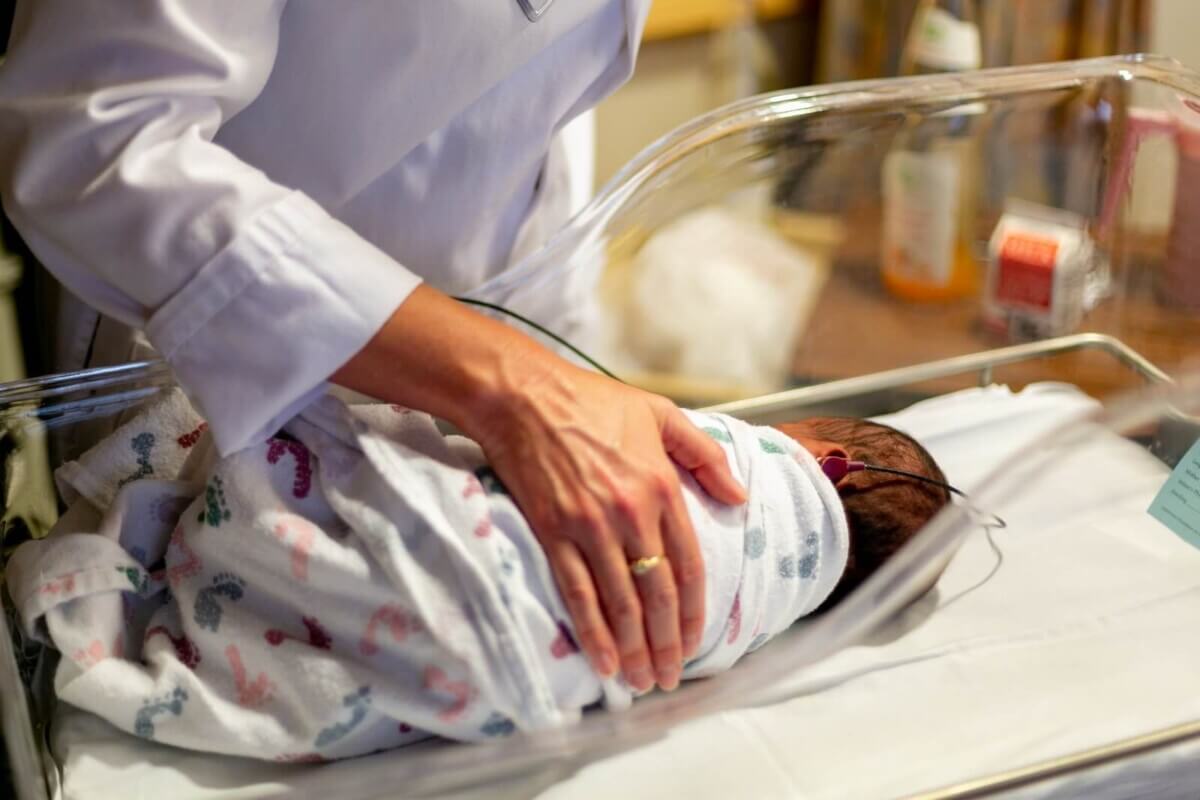 mother holding baby in hospital