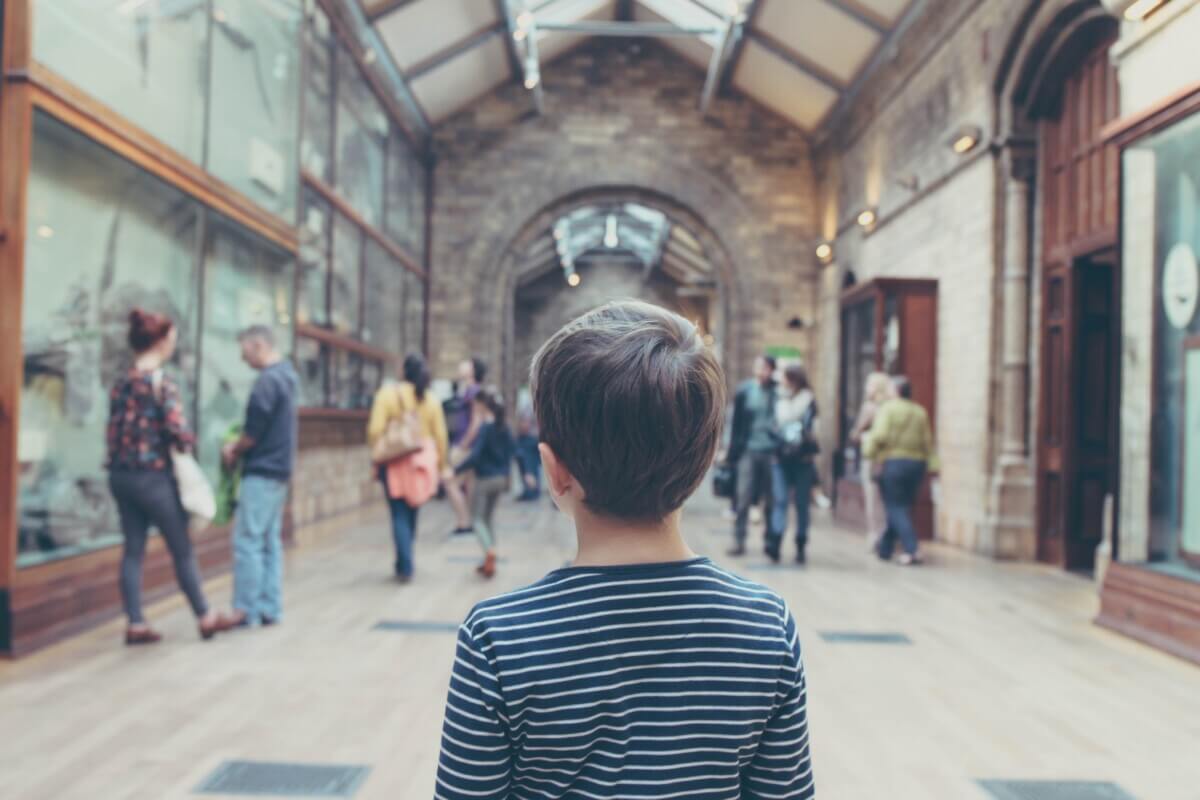 Child looking on at a museum