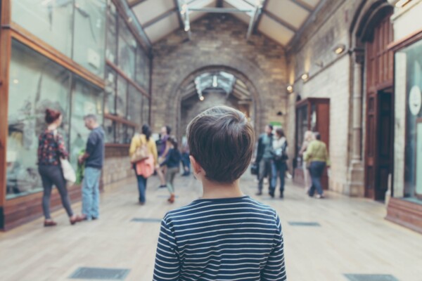 Child looking on at a museum