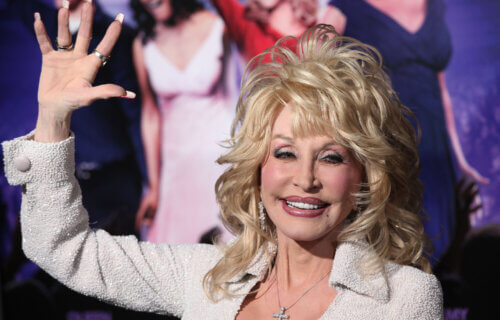 Dolly Parton waves to fans
