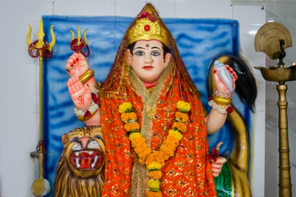 A beautiful idol of Maa Durga being worshipped at a Hindu temple