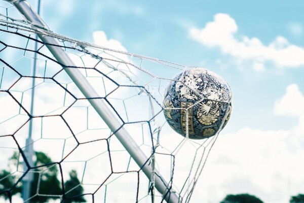 Soccer ball hitting a goal net