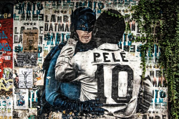Batman and Pele hugging artwork