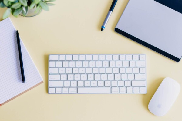 a wireless keyboard and a mouse on a desk