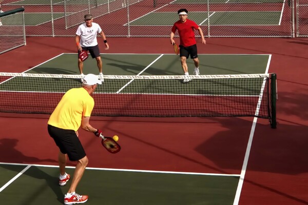 4 players in a pickleball game