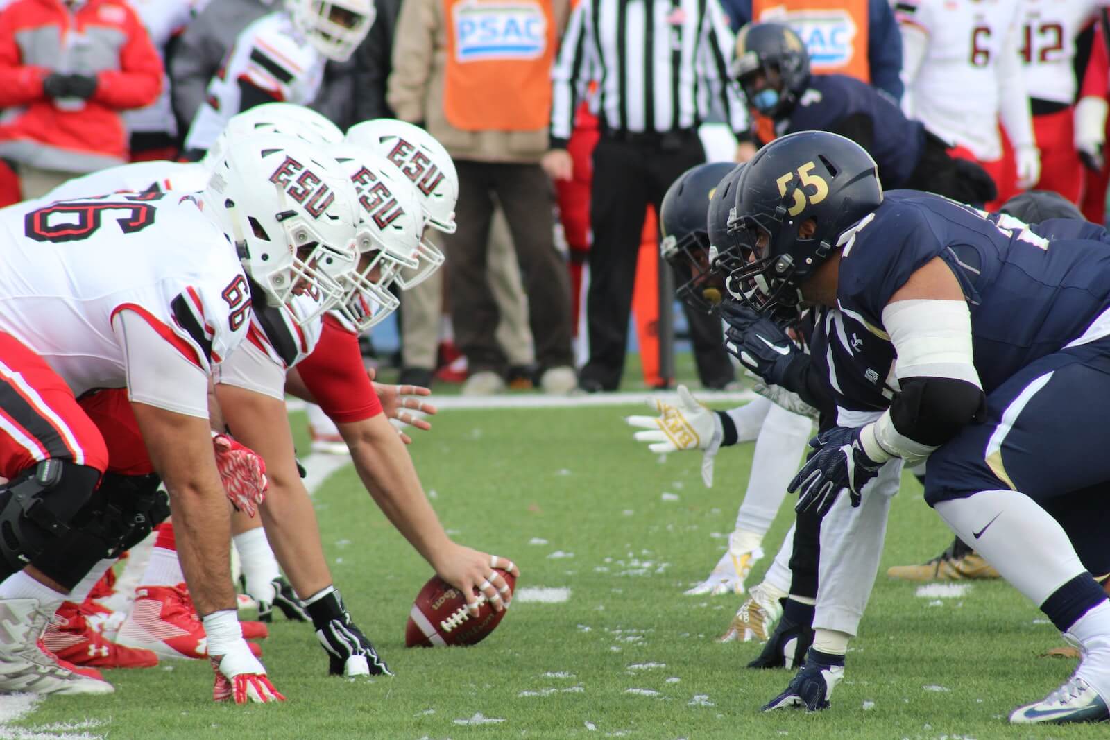 image of football players lined up before the ball is snapped