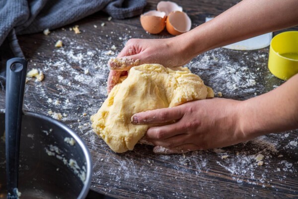 Someone kneading bread