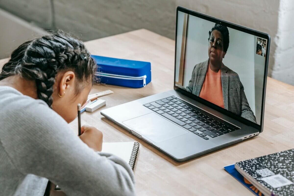 student working while teacher watches online