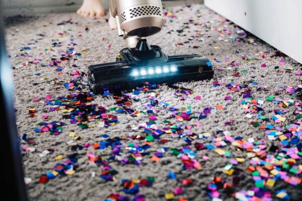 Someone vacuuming confetti