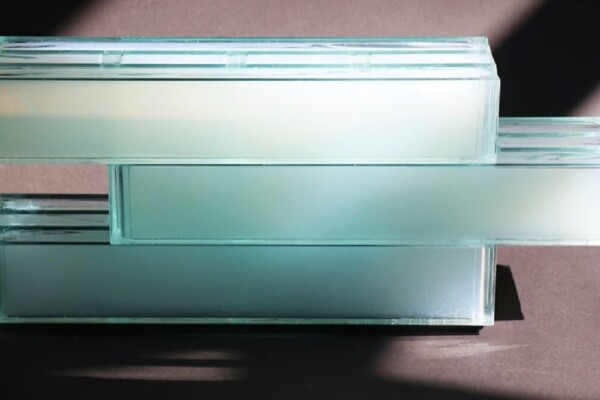 Pic of three greenish glass bricks stacked on top of each other.