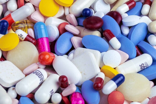 A pile of different colored pills