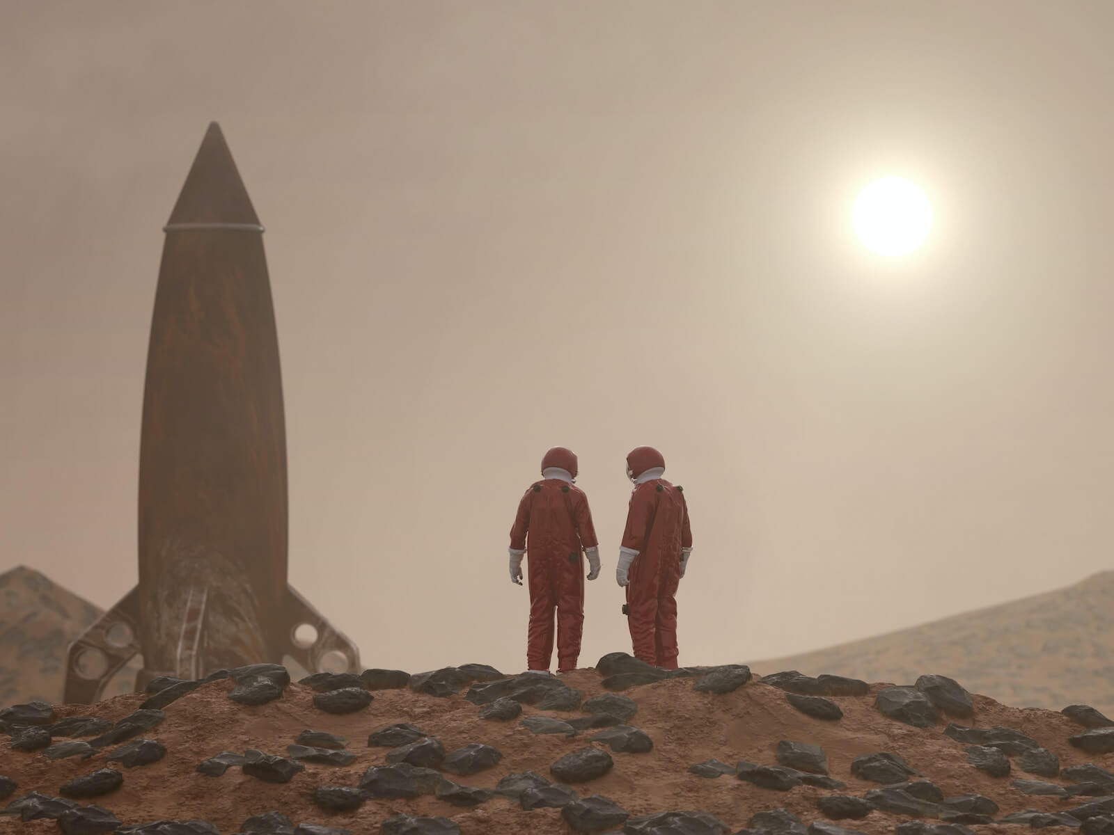 Astronauts standing by a rocket ship
