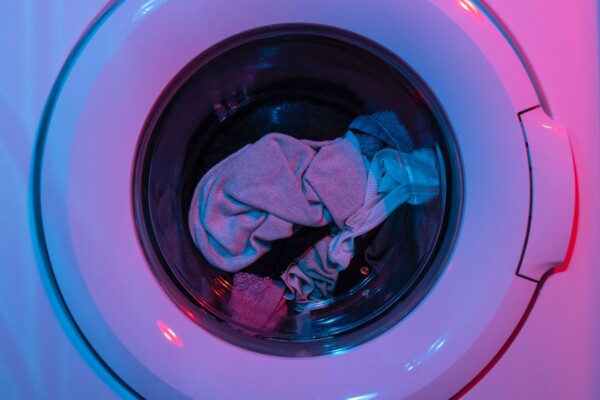 Laundry machine in pink lighting