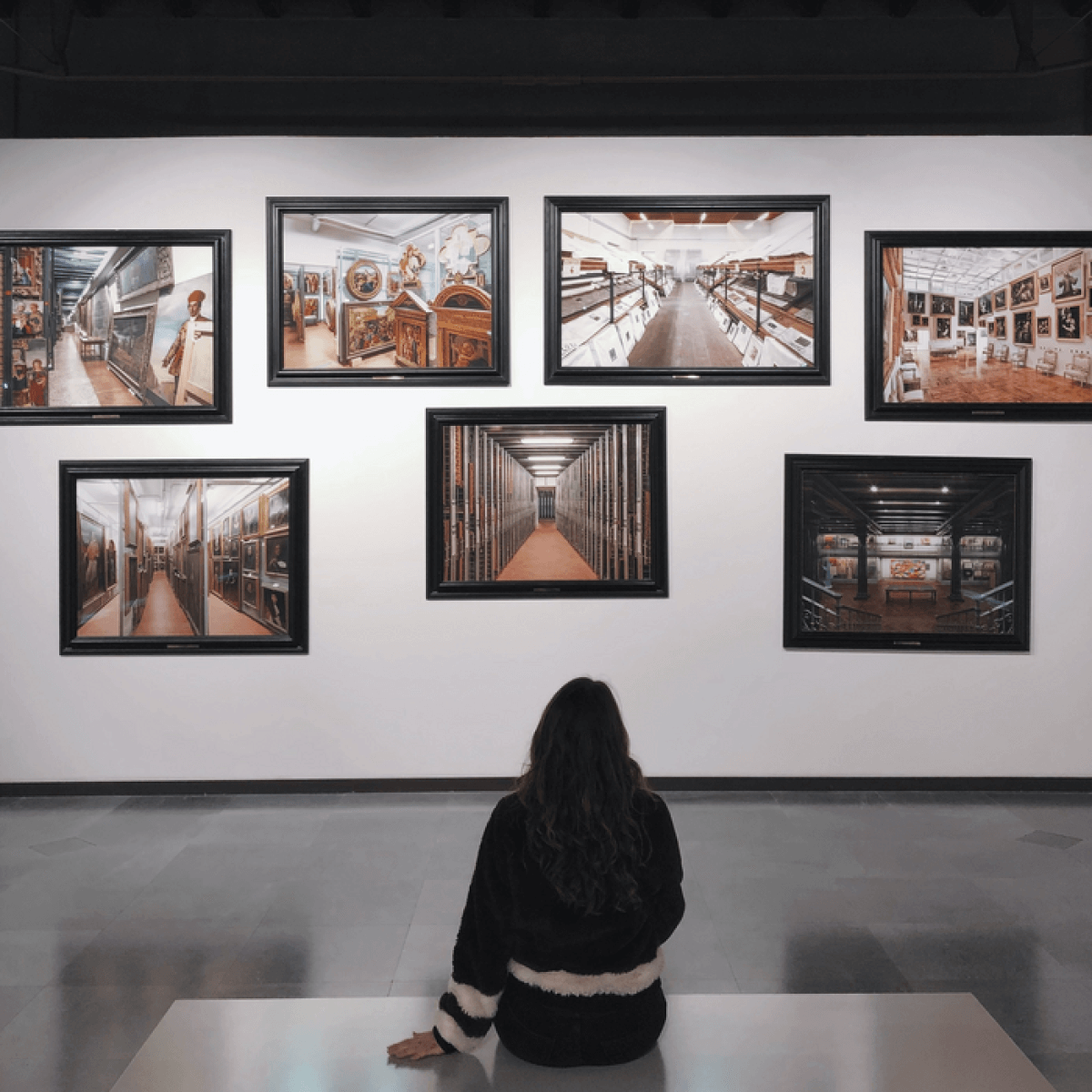 Woman sitting in an art gallery.