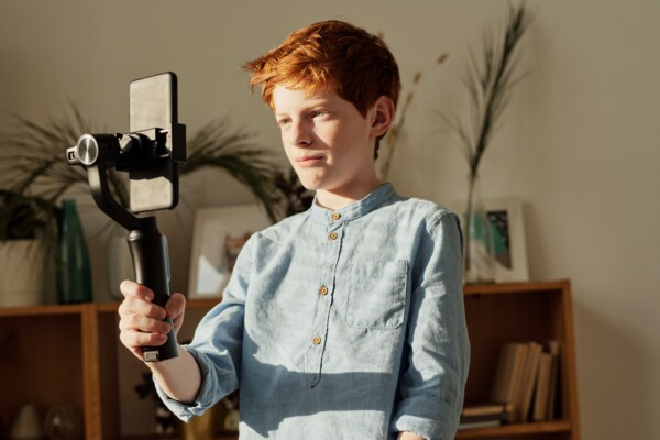 Young boy using a smartphone camera