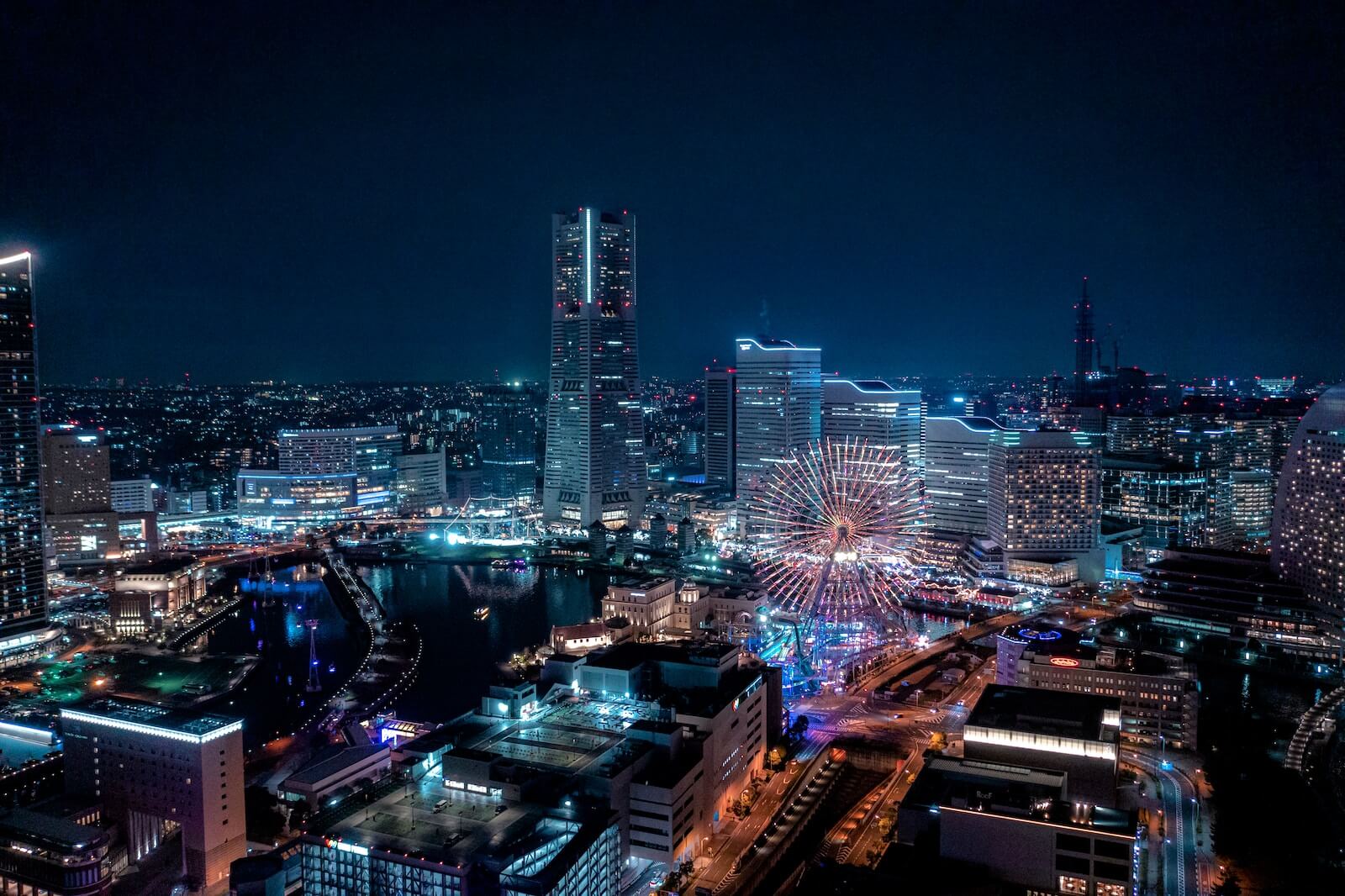 a view of a city at night from the top of a building