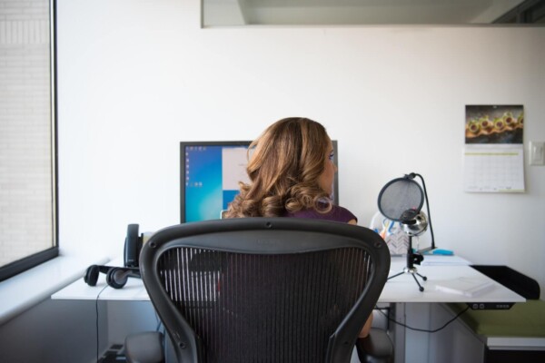 Woman sitting in her home office