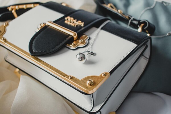 black, white and gold Prada purse