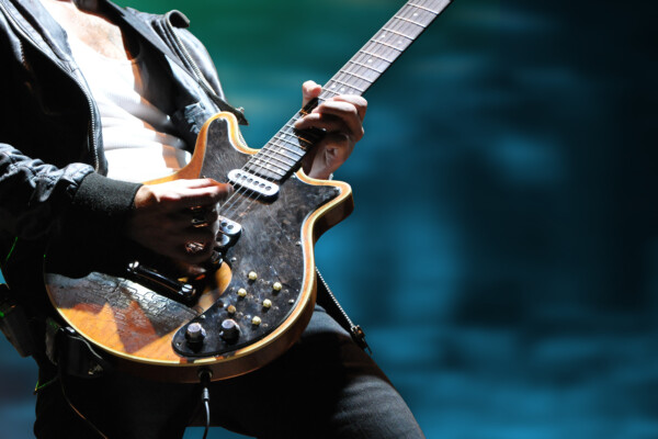 musician playing electric guitar