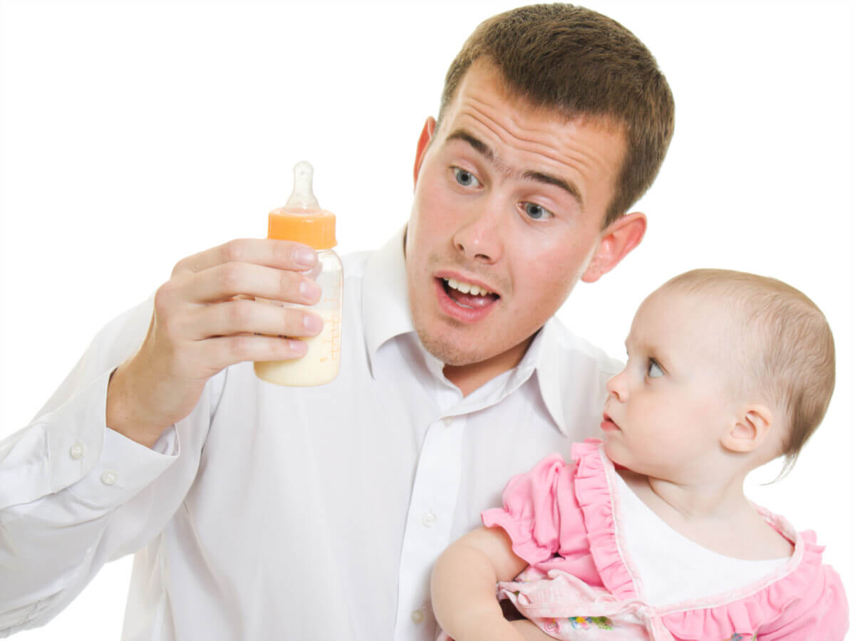 father with a baby bottle
