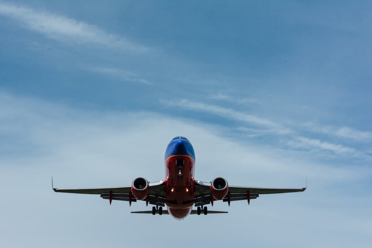 blue and red airplane in the sky