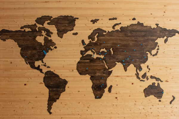 brown wooden map of the continents