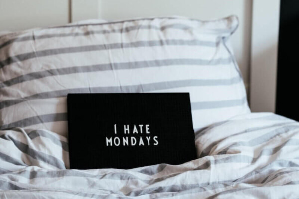 I hate Mondays sign on bed