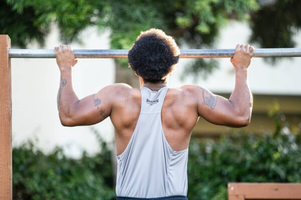Man doing pull-up while working out