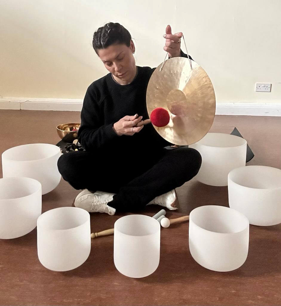Tia Harris performs sound therapy