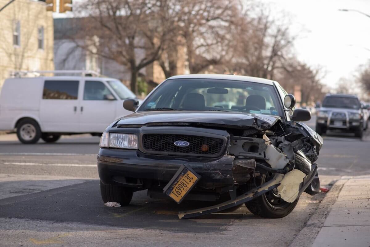 black car in an accident