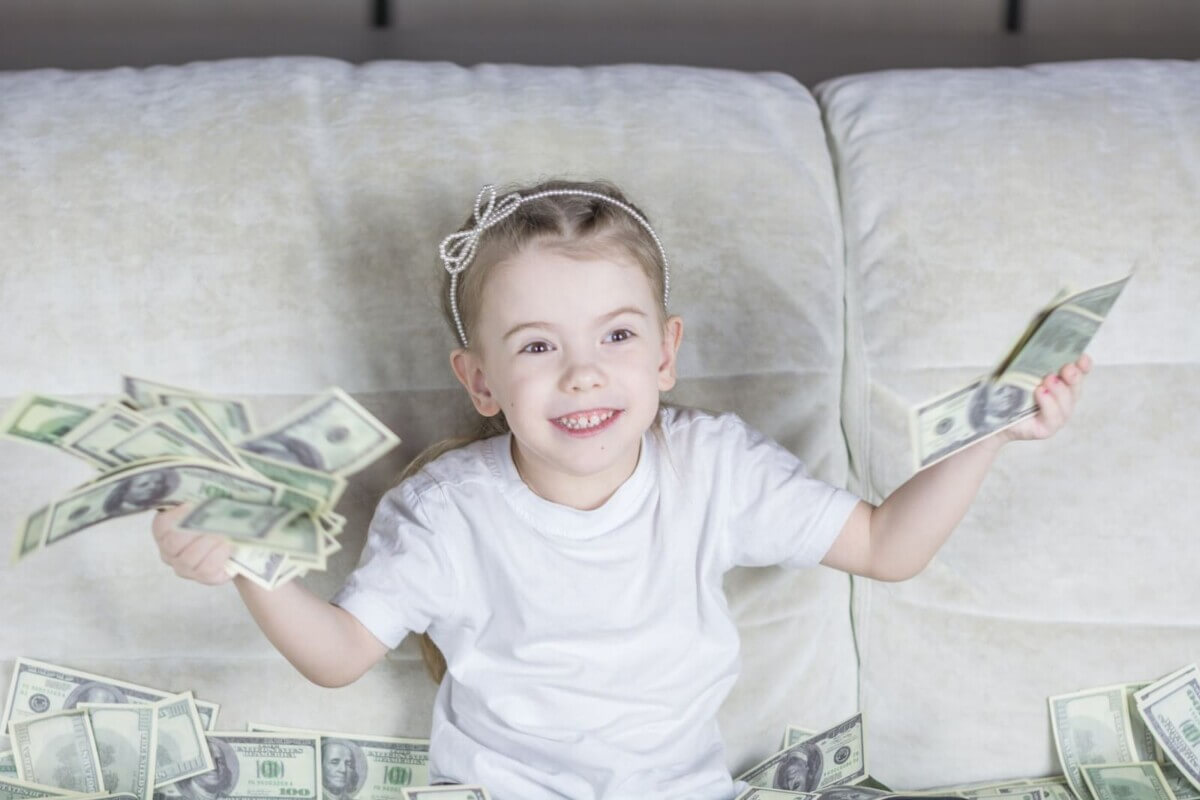 Young girl holding money