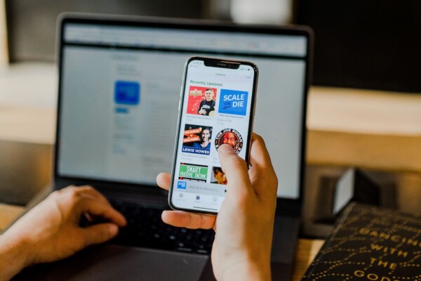 Person looking at podcasts on a smartphone