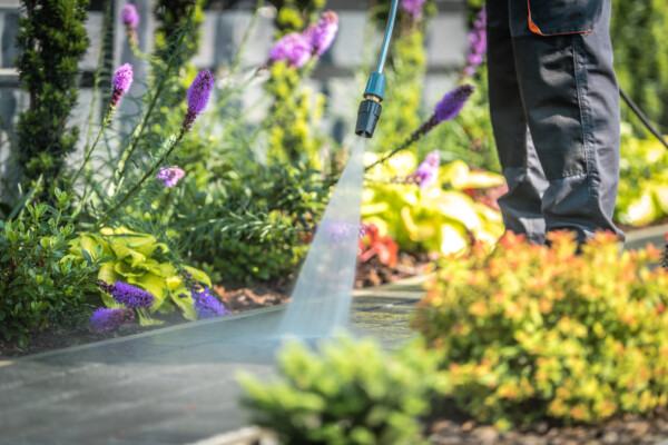 Power washing a garden walkway
